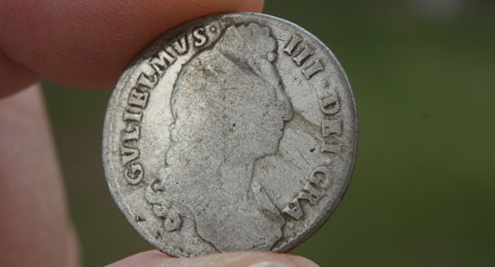 Metal detecting finds - Large silver shilling from the reign of William 111 dated 1700.