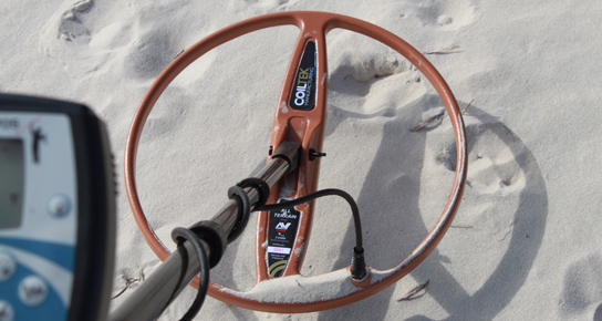 X-TERRA 15-inch Double-D metal detector coil at the beach