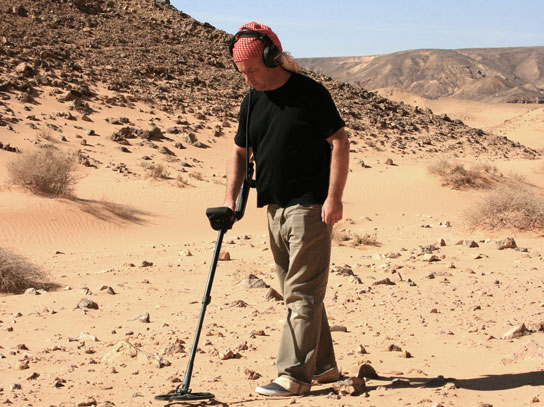 Julian Evan-Hart metal detecting amongst the dunes of Jordan at Batn al Ghul