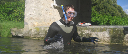 David Cuisinier metal detecting in a river
