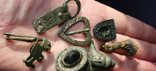 Roman brooches, medi seal matrix and brooch along with Anglo Scandinavian scabbard chape