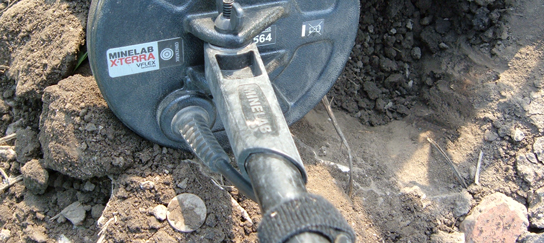 old coin found with an X-TERRA 705 metal detector in a corn field